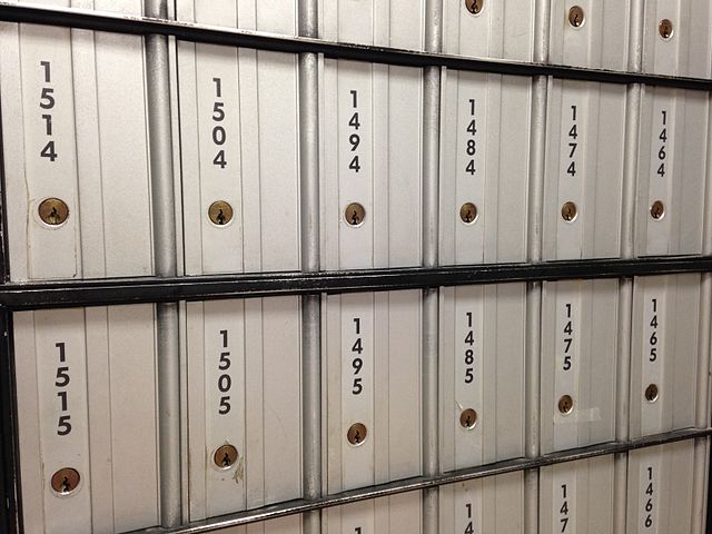 A group of mailboxes with numbers.