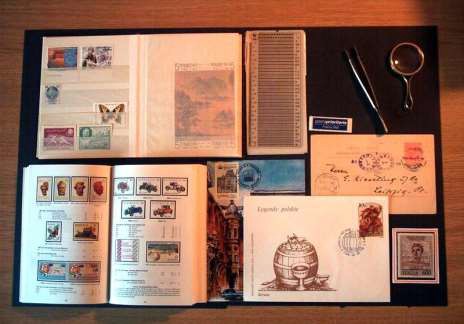 A collection of stamps and stamps on a table