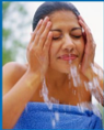 a woman washing her face