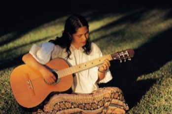 image of a woman playing guitar 