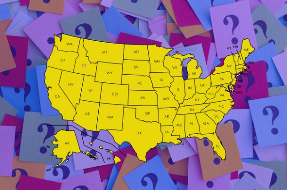 a map of the US set to a background of question marks