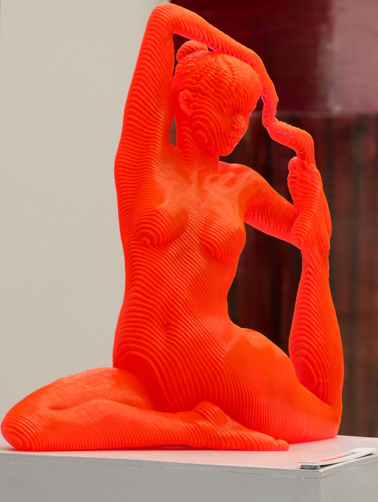 Red yoga statue. Artistic work.