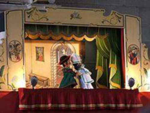 Two puppets on a set.