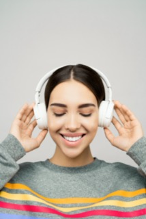 a woman listening to headphones