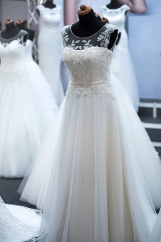 A photograph of an expensive-looking white wedding dress for a bride.