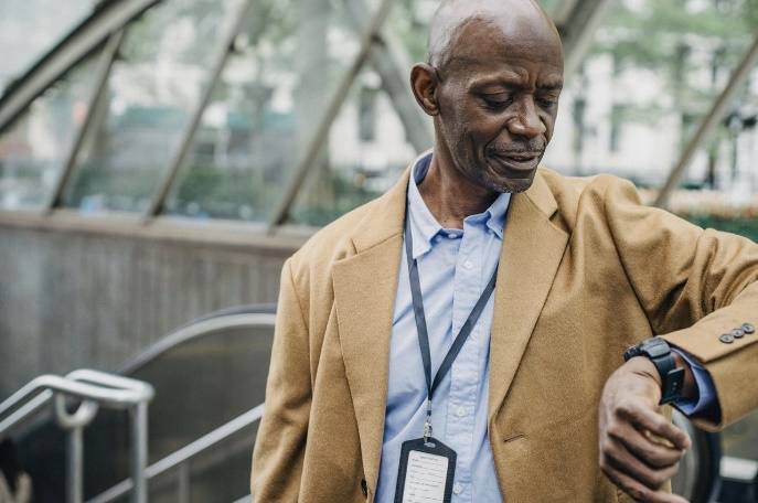 a man checking the time on his watch